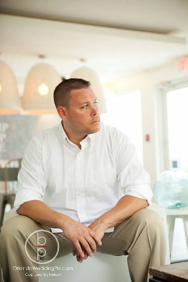 Brian Pepper wearing a white dress shirt.